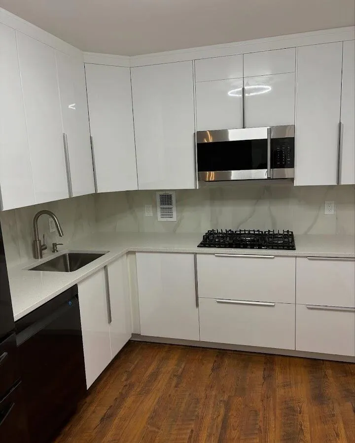 Restored kitchen with white cabinets after water damage in Harvard